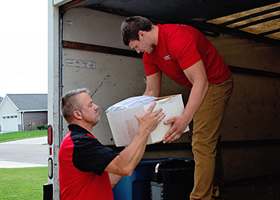 Contact Us Transferring junk removal items into the truck in Menasha