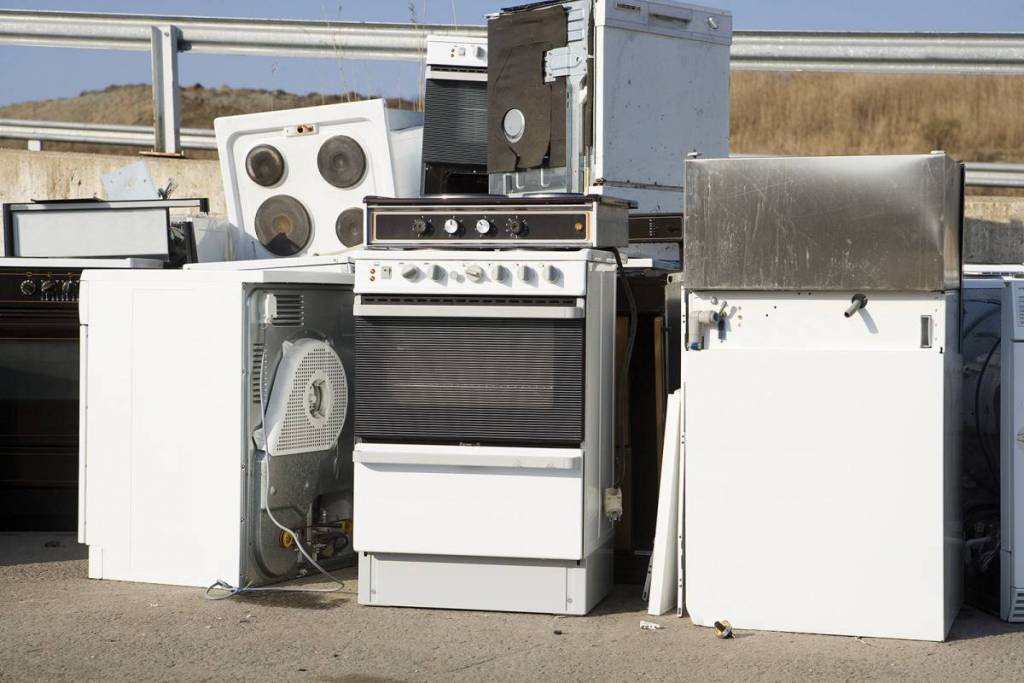 kitchen Cleanouts Old, unused appliances stacked up together appliance removal